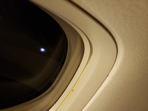 The moon reflecting on an Air Canada wing. 