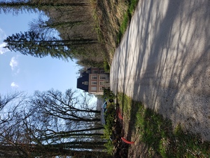 White cement road leading from town up to the Chateau and forest