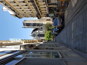 Looking up Rue Greneta, Hotel Roubaix signage on left. 