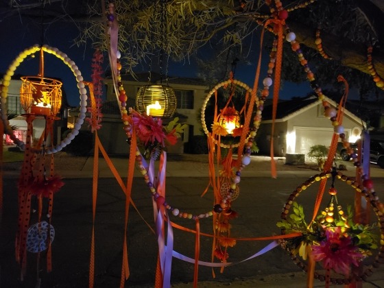 The night after Halloween, I let the LED lamps glow on through the night. A nice draped composition of beaded garland, felt banners, and hanging wire lanterns.